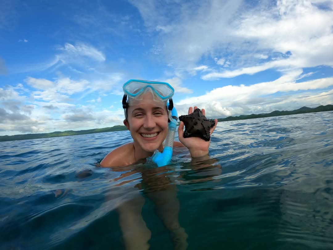 Woman snorkeling in crystal clear water