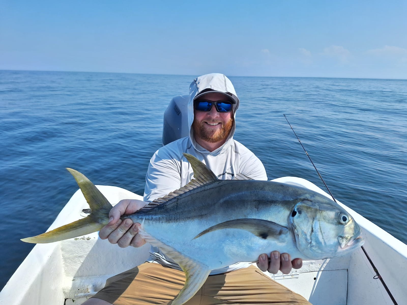 Happy angler with jack crevalle offshore Guanacaste Costa Rica